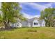 Charming home with a well-maintained yard, mature trees, and beautiful landscaping at 1840 W 100 N, Columbus, IN 47201