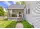 View of home exterior with screened-in porch and pool access at 1840 W 100 N, Columbus, IN 47201