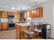 Well-appointed kitchen boasting stainless steel appliances, granite countertops, and stylish bar seating at 1840 W 100 N, Columbus, IN 47201
