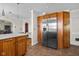 An inviting kitchen with wood cabinets, stainless steel refrigerator, and tile flooring at 1840 W 100 N, Columbus, IN 47201