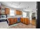 Bright and modern kitchen with stainless steel appliances, granite countertops, and hardwood flooring at 1840 W 100 N, Columbus, IN 47201