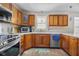 Modern kitchen featuring stainless steel appliances, granite countertops, and ample cabinet space at 1840 W 100 N, Columbus, IN 47201