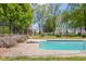 Swimming pool with diving board and surrounding foliage at 1840 W 100 N, Columbus, IN 47201