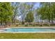 Backyard in-ground pool perfect for relaxation and entertainment, surrounded by manicured landscaping at 1840 W 100 N, Columbus, IN 47201