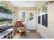 Cozy sun room with natural light, comfortable seating, and views of the outdoors, perfect for relaxation at 1840 W 100 N, Columbus, IN 47201
