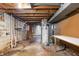 Unfinished basement with water heater and exposed utilities at 1953 N Alton Ave, Indianapolis, IN 46222