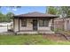 Charming single-story home with a cozy front porch and neutral siding at 1953 N Alton Ave, Indianapolis, IN 46222