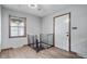 Spacious room featuring hardwood floors and a window offering views of the neighborhood at 1953 N Alton Ave, Indianapolis, IN 46222