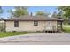 Back view of single story home with neutral siding and an asphalt driveway at 1953 N Alton Ave, Indianapolis, IN 46222
