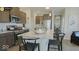 Modern kitchen with granite counters, island seating, stainless appliances, and stylish decor at 19774 Highclere Ln, Sheridan, IN 46069