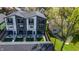 This home has fenced back yards with modern patio furniture, and second-story balconies on black-and-white, modern townhouses at 2226 Central Ave, Indianapolis, IN 46205
