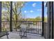 This outdoor balcony has black railings, a small table and overlooks the neighborhood at 2226 Central Ave, Indianapolis, IN 46205