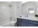 Modern bathroom with a shower, vanity, toilet, mirror, and decorative star accents at 2226 Central Ave, Indianapolis, IN 46205