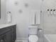 Elegant bathroom with a sleek vanity, toilet and shower with unique star accents at 2226 Central Ave, Indianapolis, IN 46205