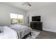 Bright bedroom featuring a bed, dresser and window at 2226 Central Ave, Indianapolis, IN 46205