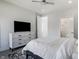 Bright bedroom with a ceiling fan, TV on dresser, and ensuite bathroom access at 2226 Central Ave, Indianapolis, IN 46205