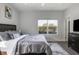 Comfortable bedroom featuring a bed, dresser, and a bright window view at 2226 Central Ave, Indianapolis, IN 46205