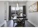 Dining room with wood table and chairs and sliding doors to the outside at 2226 Central Ave, Indianapolis, IN 46205