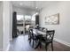 Dining room with table, chairs, light fixture and sliding doors to patio at 2226 Central Ave, Indianapolis, IN 46205