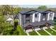 Modern townhouses with black and white siding, covered front porch, professionally landscaped lawns, and second-story balconies at 2226 Central Ave, Indianapolis, IN 46205