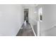 Bright hallway with hardwood floors, and a view of the property's interior through a doorway at 2226 Central Ave, Indianapolis, IN 46205