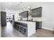 Modern kitchen with gray cabinetry, stainless steel appliances, quartz countertops, and a large island with seating at 2226 Central Ave, Indianapolis, IN 46205