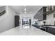 Bright, modern kitchen featuring gray cabinets, quartz countertops, stainless steel appliances, and contemporary pendant lighting at 2226 Central Ave, Indianapolis, IN 46205