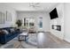 Cozy living room showcasing stylish decor, hardwood floors, and a modern fireplace feature at 2226 Central Ave, Indianapolis, IN 46205