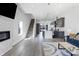 Spacious living room featuring hardwood floors, a sleek fireplace, and an open layout at 2226 Central Ave, Indianapolis, IN 46205
