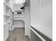 Bright, walk-in closet with shelving and hardwood floors at 2226 Central Ave, Indianapolis, IN 46205