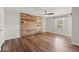 Bright bedroom featuring hardwood floors and wood accent wall for rustic contemporary design at 223 Haldale Dr, Carmel, IN 46032