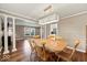 Bright dining area with a contemporary light fixture and an adjacent living space at 223 Haldale Dr, Carmel, IN 46032