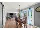 Dining room showcasing hardwood floors, modern chandelier and natural light with view of backyard at 223 Haldale Dr, Carmel, IN 46032