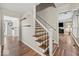 Inviting foyer with hardwood floors and a staircase leading to the upper level at 223 Haldale Dr, Carmel, IN 46032