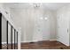 Bright entryway featuring hardwood floors and a glimpse of the home's interior at 223 Haldale Dr, Carmel, IN 46032