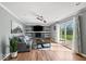 Cozy living room with fireplace, hardwood floors, natural light, and stylish décor at 223 Haldale Dr, Carmel, IN 46032