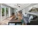 Inviting living room with hardwood floors and sliding glass doors to backyard and natural light at 223 Haldale Dr, Carmel, IN 46032