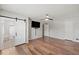 Main bedroom suite with private bath, stylish barn door and hardwood flooring at 223 Haldale Dr, Carmel, IN 46032