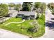 Aerial view of a well-maintained home with a lush green lawn and mature trees at 251 S 12Th Ave, Beech Grove, IN 46107