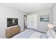 Comfortable bedroom with warm decor, neutral walls, carpet flooring and great closet space at 251 S 12Th Ave, Beech Grove, IN 46107