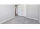 A secondary bedroom with neutral walls, carpet flooring and large closet at 251 S 12Th Ave, Beech Grove, IN 46107