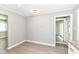 This dining room features light gray brick wall, modern lighting, and wood flooring at 251 S 12Th Ave, Beech Grove, IN 46107