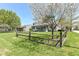 Charming home with a cozy porch, fenced yard, and mature landscaping at 251 S 12Th Ave, Beech Grove, IN 46107