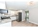 View of kitchen with stainless steel appliances, hardwood floors and neutral walls at 251 S 12Th Ave, Beech Grove, IN 46107
