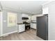 View of kitchen with stainless steel appliances, hardwood floors and neutral walls at 251 S 12Th Ave, Beech Grove, IN 46107
