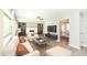 A spacious living room is styled with modern furniture and opens to the dining area at 251 S 12Th Ave, Beech Grove, IN 46107