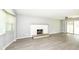 Bright and airy living room with a brick fireplace and neutral colors at 251 S 12Th Ave, Beech Grove, IN 46107