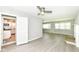View of living room with hardwood floors, neutral walls, ceiling fan and open to the Kitchen at 251 S 12Th Ave, Beech Grove, IN 46107