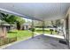Covered patio with view of backyard, shed and grill at 251 S 12Th Ave, Beech Grove, IN 46107