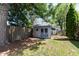 Exterior shot of backyard shed with double doors and a privacy fence at 251 S 12Th Ave, Beech Grove, IN 46107
